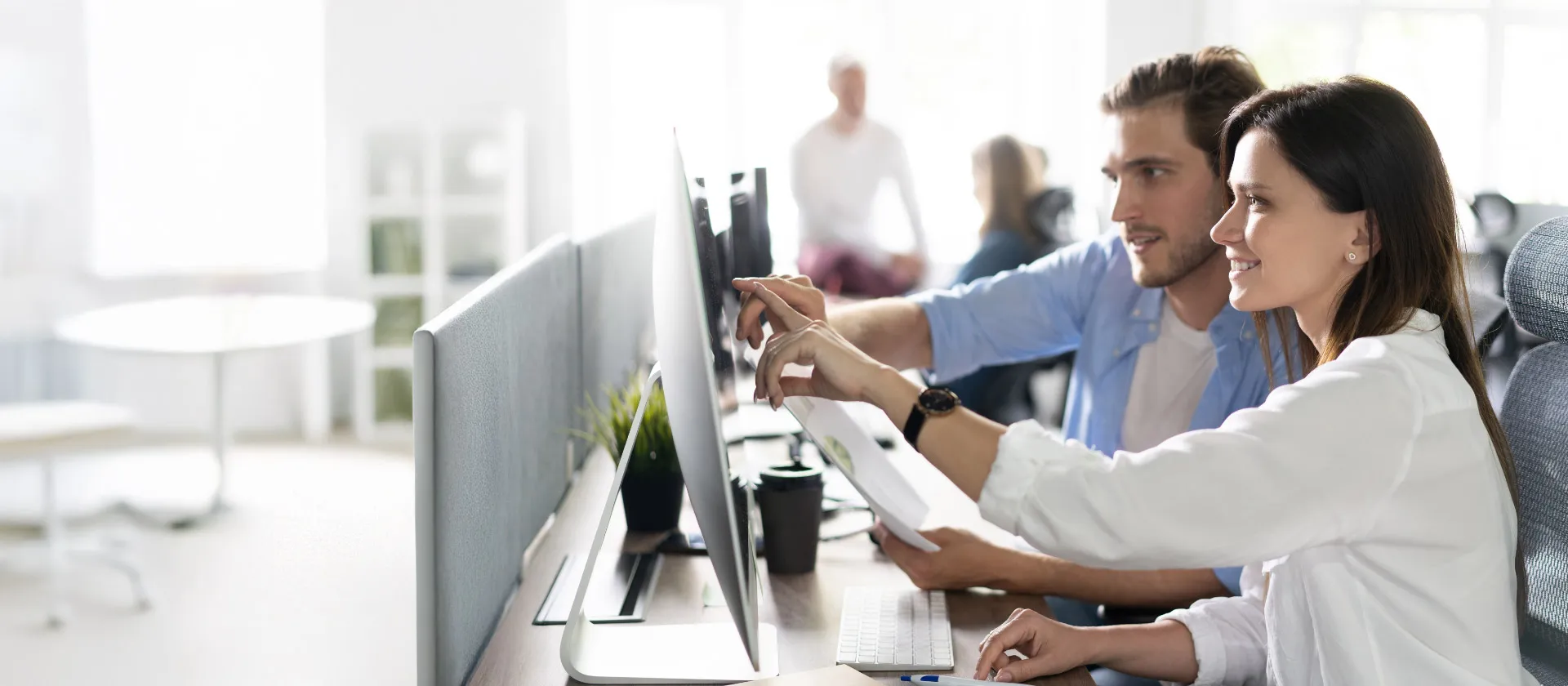 header image of two people collaborating at a computer with text promoting FPSL solution efficiency.