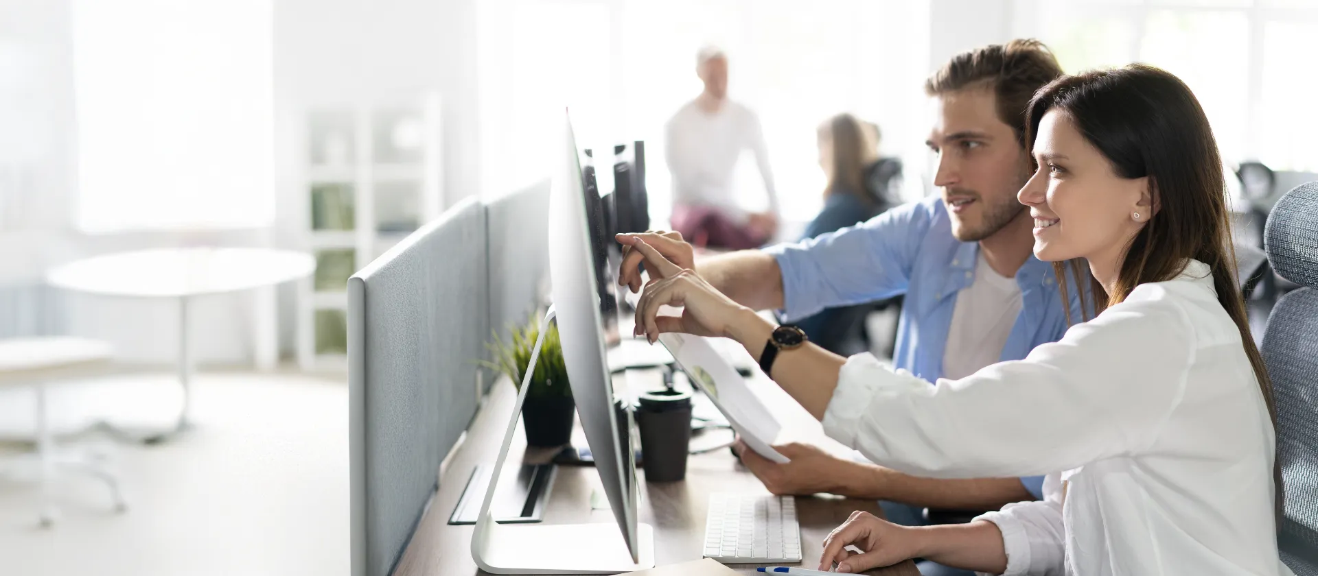 header image of two people collaborating at a computer with text promoting FPSL solution efficiency.