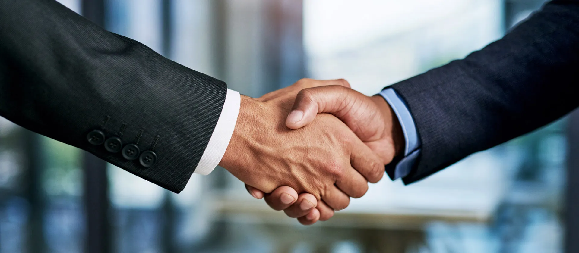 msg global and plaut partnership symbolized by an image of two people shaking hands