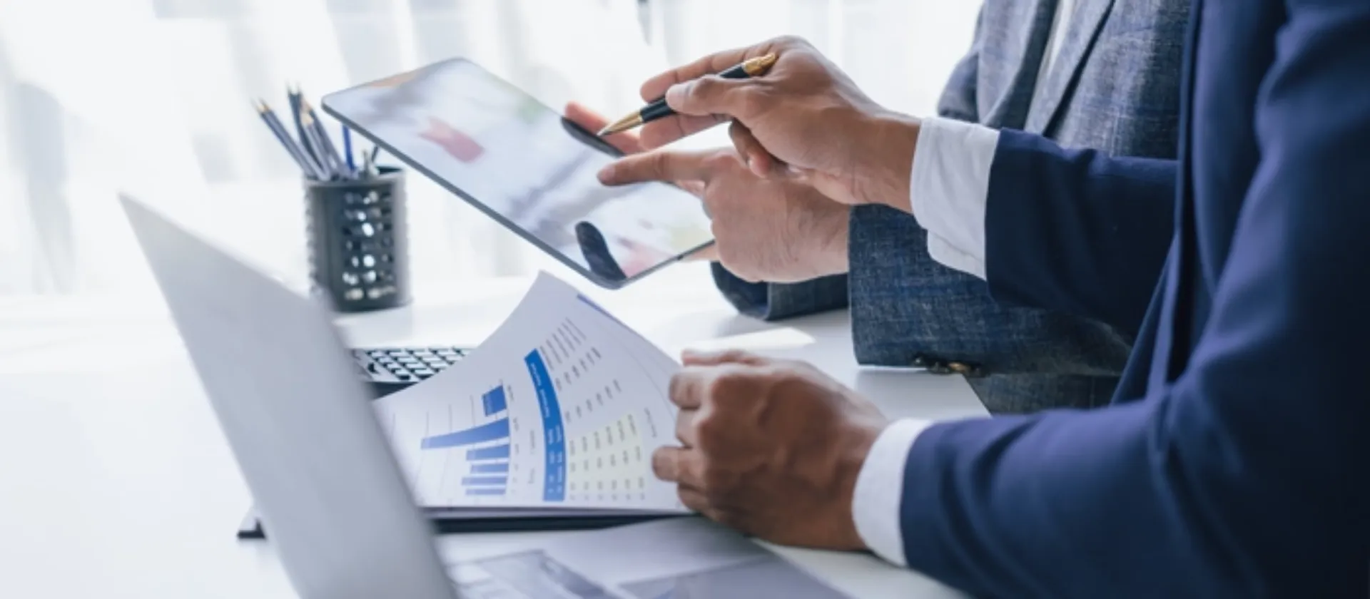 Businessmen going through finance and tax reporting.