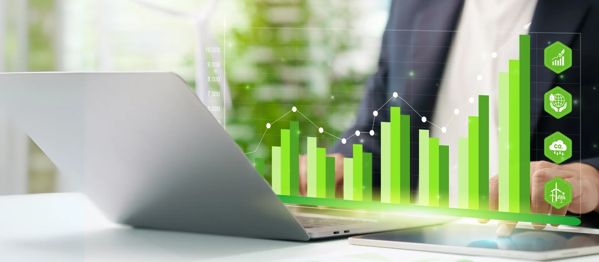 man on computer doing sustainability reporting