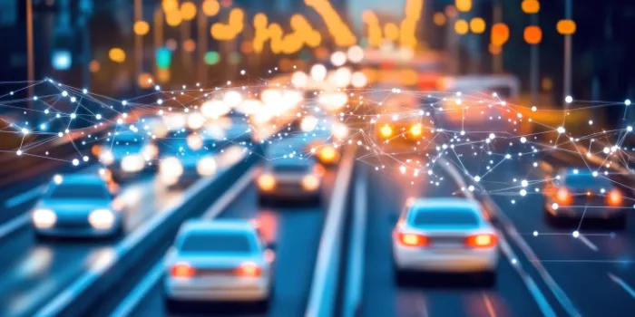 Abstract network overlay above moving cars on a city highway, symbolizing connected mobility and vehicle data exchange.