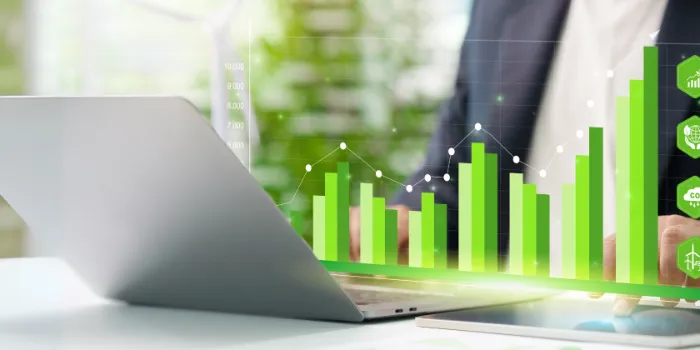 man on computer doing sustainability reporting